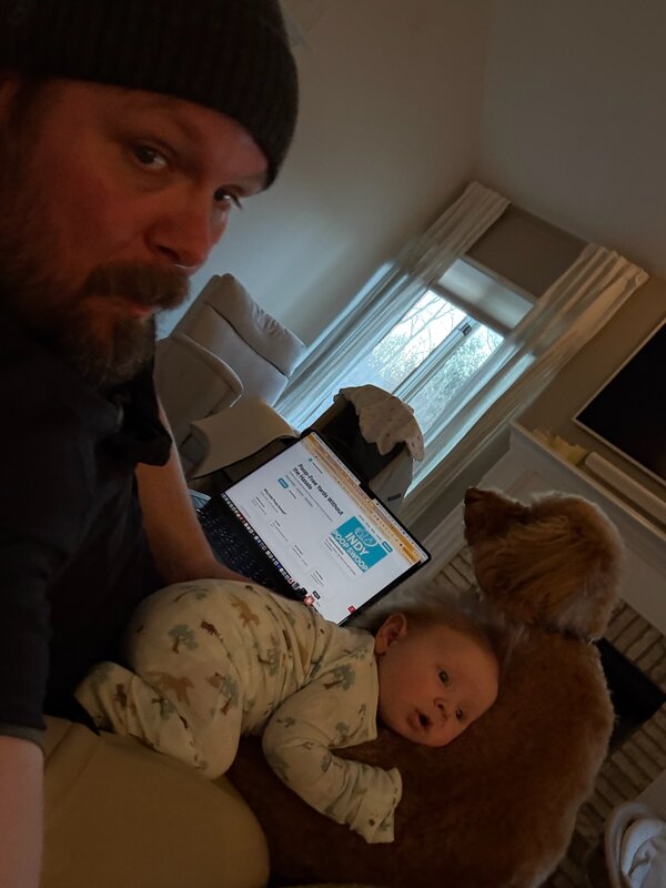 Tom with baby Alex and pup building Indy Poop Swoop